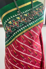 PRARTHI - RED PATOLA WITH SLANTED IKAT BODY AND GREEN BORDER