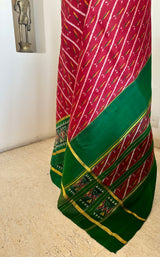 PRARTHI - RED PATOLA WITH SLANTED IKAT BODY AND GREEN BORDER