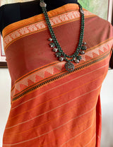 SRUJANA – ORANGE VELDHARI COTTON WITH TEMPLE PEACOCK BORDER