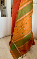 SRUJANA – ORANGE VELDHARI COTTON WITH TEMPLE PEACOCK BORDER