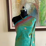 MALIHA – JEWEL-TONED TEAL BANARASI SILK SAREE ELEGANCE