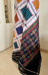 MRIGANKAA – VIBRANT ASHWINI COTTON SAREE WITH BLACK AANCHAL FLORALS