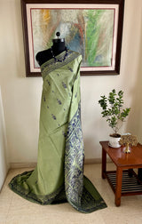 MOHONA – OLIVE GREEN BALUCHARI SAREE WITH NAVY MYTHOLOGICAL MOTIFS