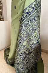 MOHONA – OLIVE GREEN BALUCHARI SAREE WITH NAVY MYTHOLOGICAL MOTIFS