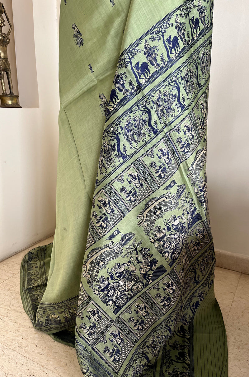 MOHONA – OLIVE GREEN BALUCHARI SAREE WITH NAVY MYTHOLOGICAL MOTIFS