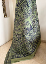 MOHONA – OLIVE GREEN BALUCHARI SAREE WITH NAVY MYTHOLOGICAL MOTIFS