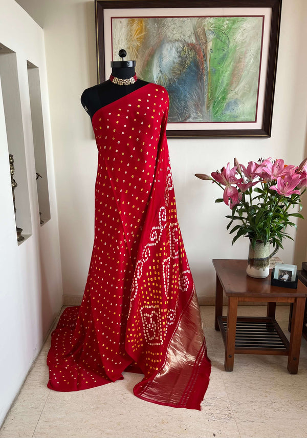 SAROJ- RADIANT RED GAJI SILK LAGDI PATTA WITH ZARI AND BANDHANI MOTIFS