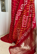 SAROJ- RADIANT RED GAJI SILK LAGDI PATTA WITH ZARI AND BANDHANI MOTIFS