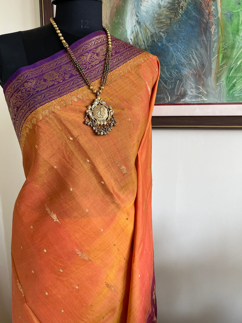 MORVIKA – BURNT ORANGE GADWAL SILK  WITH PURPLE FLORAL ZARI