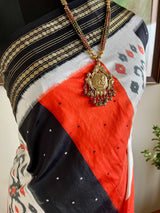 EKANTAA – POCHAMPALLY SILK IN ORANGE, BLACK, WHITE WITH IKAT GRID