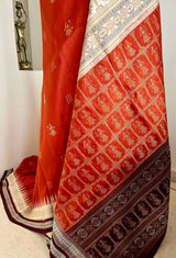 ANITA - RUST BOMKAI SAREE WITH DOLL AND RUDRAKSHA MOTIFS