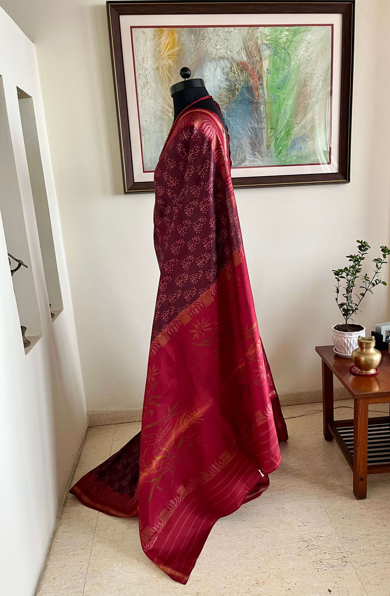 AHNA- TOFFEE PATOLA SILK SAREE WITH RED LOTUS BORDER, FLORAL AANCHAL