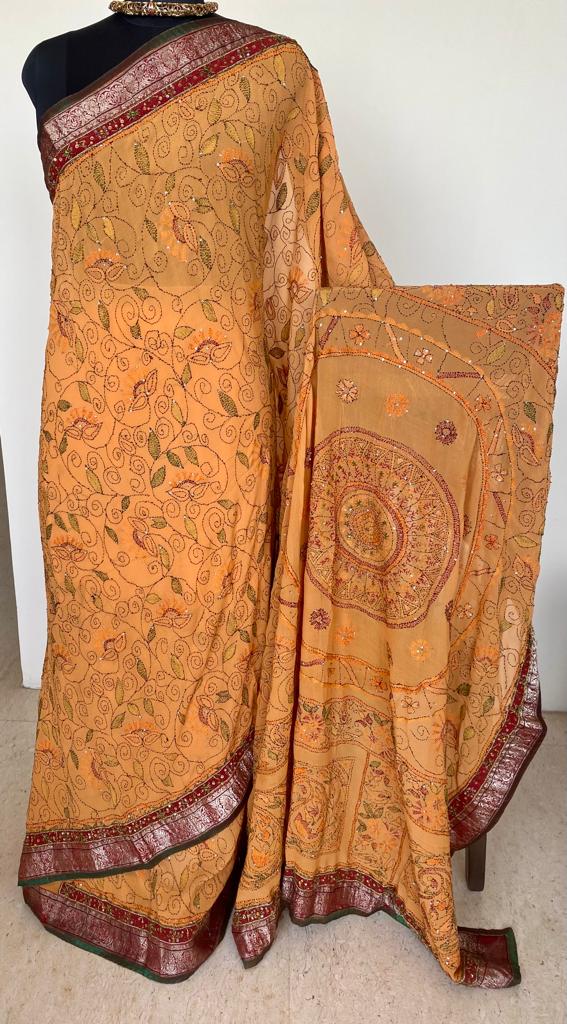 NAYANIKA- A BEAUTIFUL PURE GEORGETTE IN BEIGEISH ORANGE WITH KANTHA HAND EMBROIDERY AND A BANARASI BORDER