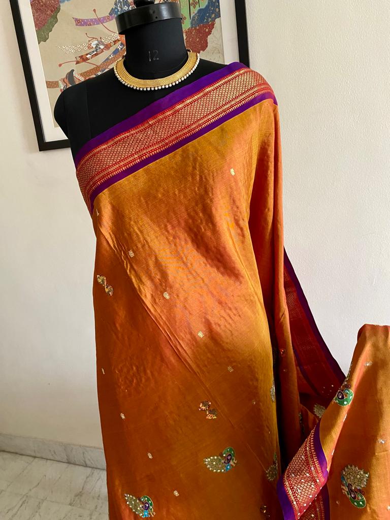 AADNYA- REGAL PAITHANI ELEGANCE, A MESMERIZING BLEND OF MUSTARDISH BROWN AND PURPLE WITH EXQUISITE MOTIFS, SEQUINS AND EMBROIDERY
