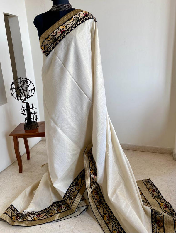BIANCA- AN OFFWHITE COTTON AND ZARI BLEND TISSUE SAREE WITH WOVEN BORDER AND AANCHAL IN CONTRAST COLOURS.