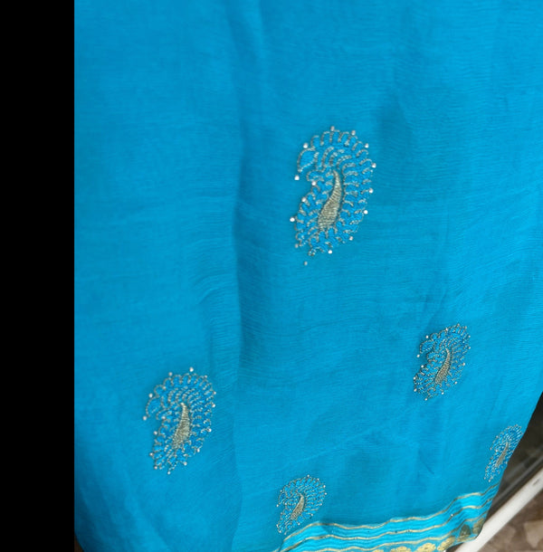 ASMAT- A PURE FRENCH CHIFFON IN COPPER SULPHATE BLUE WITH GOLDEN AMBIS AND ZARI BORDER