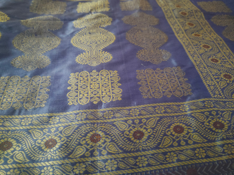 URMILA- A VIOLET, SILK SAREE WITH GOLDEN ZARI WORK ALL OVER THE BODY, BORDER AND A FULLY WOVEN AANCHAL