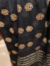 KALI PARI- A BEAUTIFUL BLACK CHIFFON SAREE WITH KHADI WORK MOTIFS IN THE BODY AND THIN GOLD WEAVE BORDER EXTENDING TO THE AANCHAL