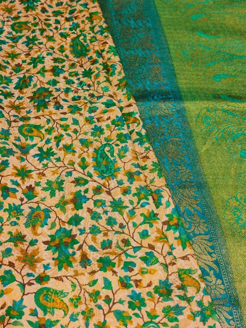 VANAJA- A PEACHISH CREAM BLENDED MATKA SILK SAREE WITH AMBI AND FLORAL PRINT AND BLUE GREEN BORDER