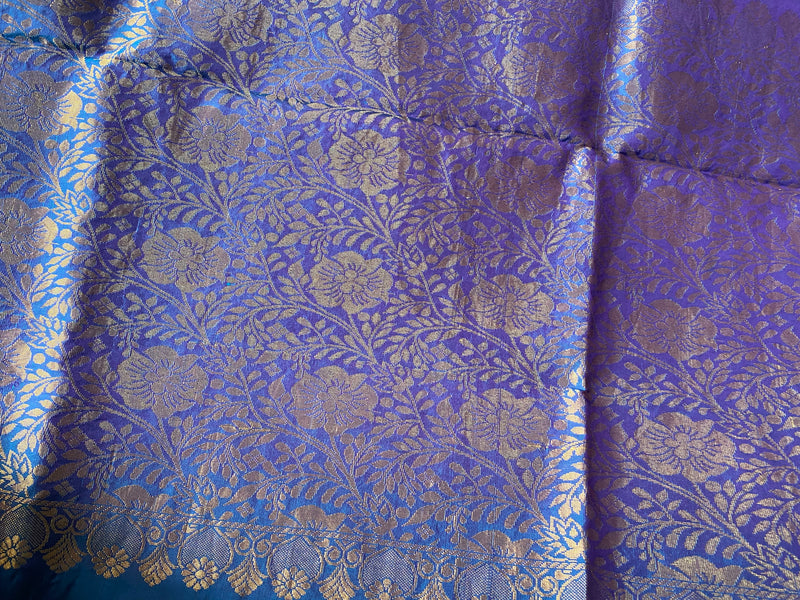 SWAPNALI- A GORGEOUS BLUE COLOUR SILK SAREE WITH SMALL ZARI BOOTIS, GOLD AND PURPLE BORDER AND A FLORAL PURPLE AND GOLD WEAVE AANCHAL