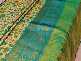 VANAJA- A PEACHISH CREAM BLENDED MATKA SILK SAREE WITH AMBI AND FLORAL PRINT AND BLUE GREEN BORDER