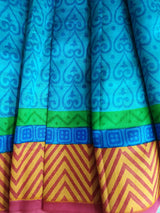UMA- A PRINTED BLUE SILK WITH  MULTILAYERS IN BLUE, GREEN AND CHEVRON IN BROWN AND OFFWHITE BORDER AND AANCHAL