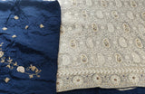 SHARMILA- AN EXQUISITE PURE SILK CHIFFON IN GREY WITH ELABORATE CHIKANKARI INSPIRED MACHINE EMBROIDERY AND HAND ZARDOSI WORK IN THE UPPER PART OF THE SAREE.  A CONTRAST BORDER OF MIDNIGHT BLUE IN SATIN SILK, EMBROIDERED SILK CONTRAST BLOUSE PIECE