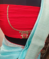 JAL PARI- A BLUE PURE LINEN SAREE WITH CONTRAST RED COLOURED EMBROIDERED BLOUSE PIECE