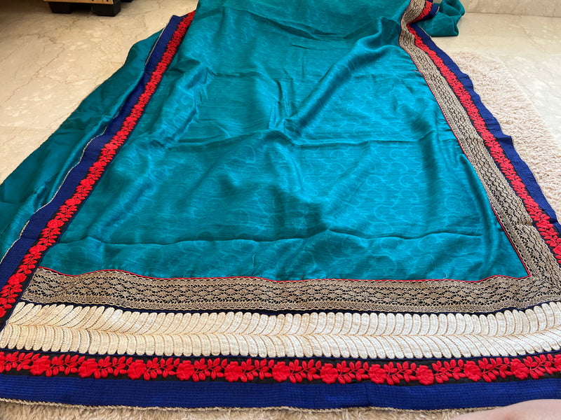 ROMA- A VIBRANT BLUE COTTON SILK SAREE WITH A DARKER BLUE EDGING AND ELABORATE THREE LAYERED BORDER