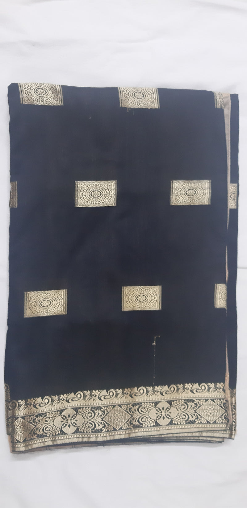 NEESHA- A COTTON SILK BLEND SAREE WITH GOLD MOTIFS IN THE BORDER AND AANCHAL OVER THE BLACK BASE