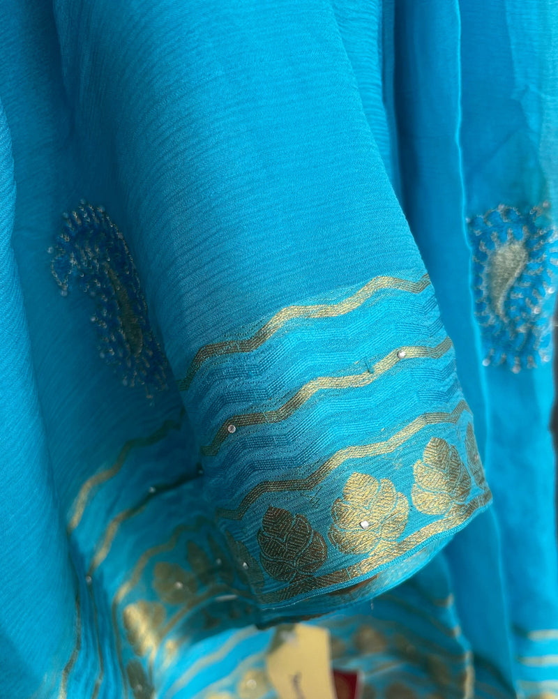 ASMAT- A PURE FRENCH CHIFFON IN COPPER SULPHATE BLUE WITH GOLDEN AMBIS AND ZARI BORDER