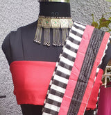 JIYA- A BEAUTIFUL TISSUE SAREE WITH RED AND BLACK CHECKS ON WHITE