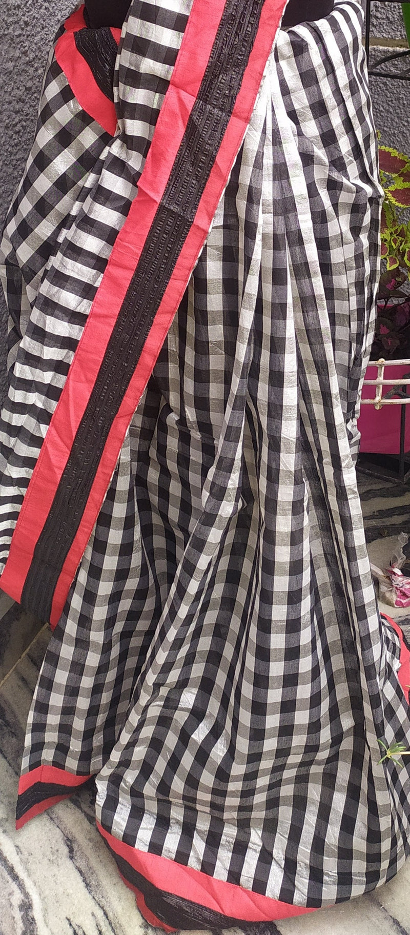 JIYA- A BEAUTIFUL TISSUE SAREE WITH RED AND BLACK CHECKS ON WHITE
