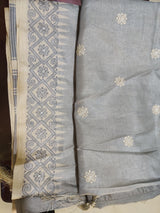 ISRA- A GREY TUSSAR SILK BLEND SAREE WITH FLORAL EMBROIDERY ON THE BODY AND BORDER