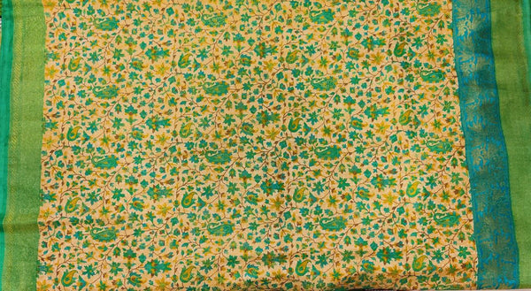 VANAJA- A PEACHISH CREAM BLENDED MATKA SILK SAREE WITH AMBI AND FLORAL PRINT AND BLUE GREEN BORDER