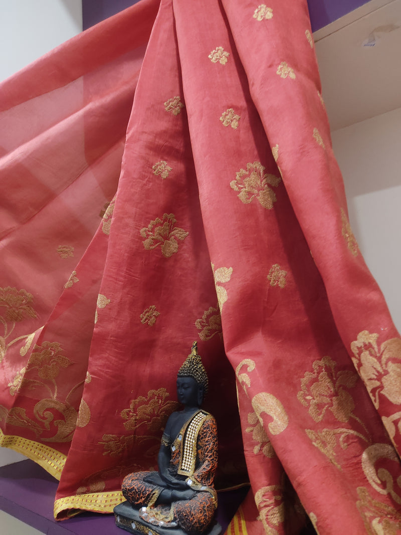 NAVODHA- A PEACH SILK SAREE WITH DULL GOLD FLORAL EMBROIDERY, GOLD ZARI BORDER AND HEAVY WORK IN THE AANCHAL