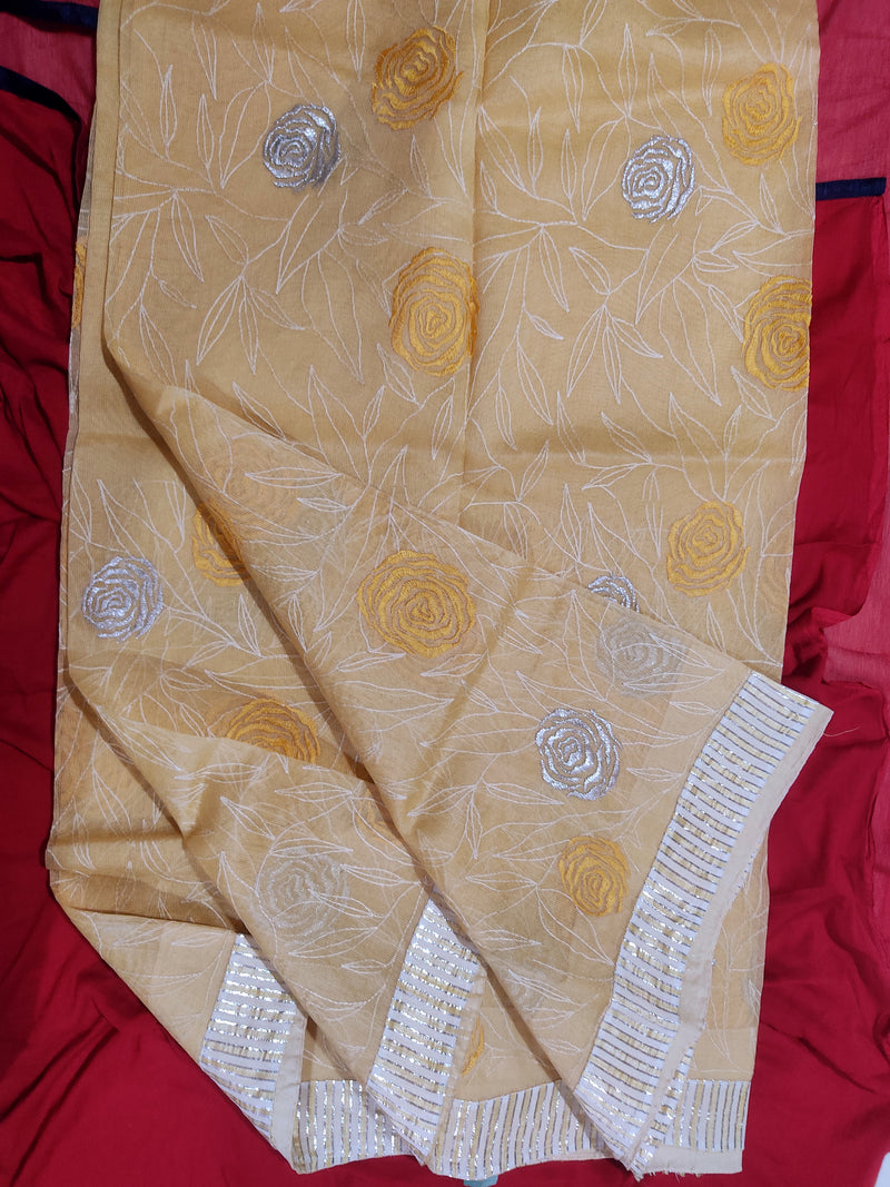 DHARVIKA- A LIGHTWEIGHT AND COMFORTABLE SUPERNET SAREE WITH SILVER ROSE PATTERN ENBROIDERY AND LEAF WEAVE THROUGH OUT THE BODY, YELLOW AND SILVER ZARI STRIPS IN THE AANCHAL
