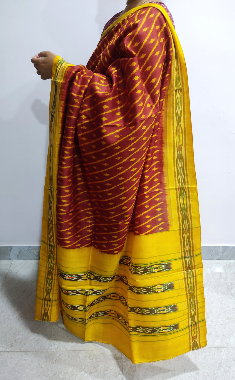 SUROHINI- A DEEP RUST RED SAMBALPURI HANDLOOM, PURE SILK SAREE  WITH A BEAUTIFUL BORDER AND TRADITIONAL AANCHAL