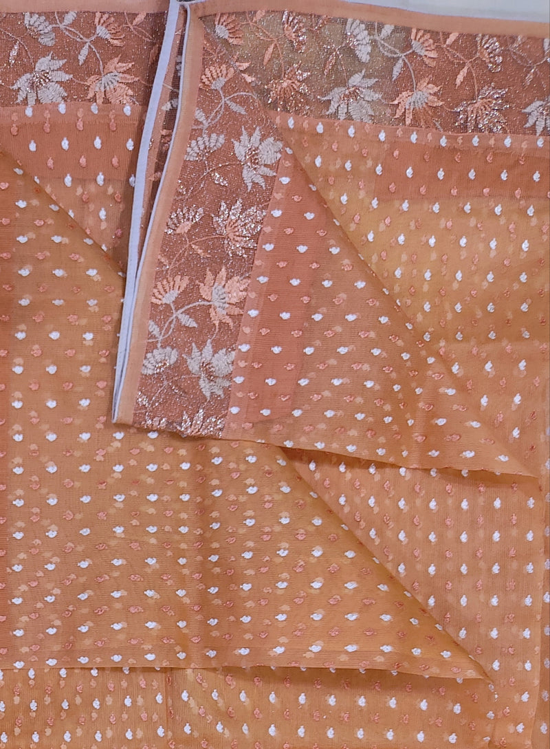BIJAYA- A LIGHT PEACH COLOURED SUPERNET SAREE WITH BEAUTIFUL PATTERN ALL OVER THE BODY AND ZARI ROSE GOLDEN BORDER