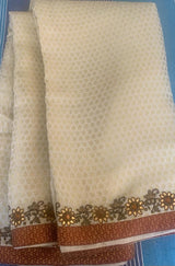 AAINA- A SELF WEAVE, CREAM COLOURED TANCHOI SILK WITH EMBELLISHMENTS AND MIRROR WORK