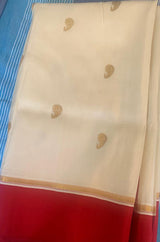POOJA- A CREAM AND RED BENGAL SILK SAREE WITH ZARI BOOTIS ALL OVER THE BODY AND A ZARI AANCHAL