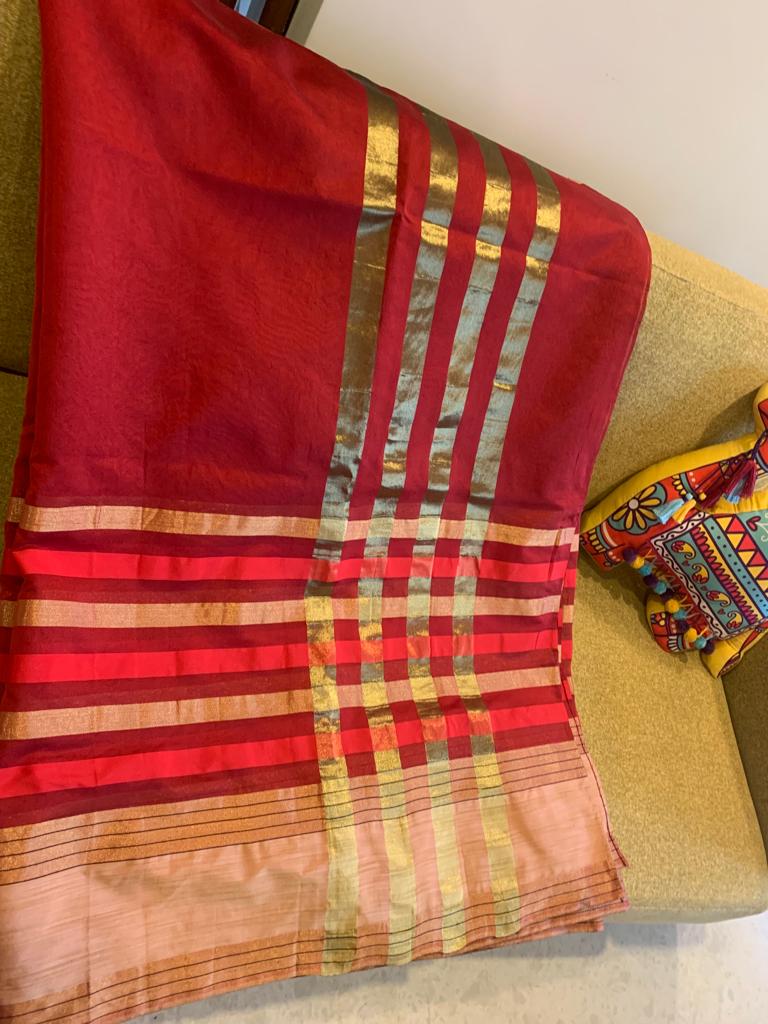 SINDOORI- A SILK BLEND SAREE IN A RICH RED COLOUR AND GOLDEN EDGING
