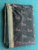 DAKSHINI- A BLACK SILK BLEND SAREE WITH MOTIFS IN CONTRAST PINK AND EMBROIDERY