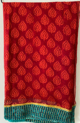 AALIA- A BEAUTIFUL PRINTED PURE CHIFFON IN RED WITH A GREEN BORDER