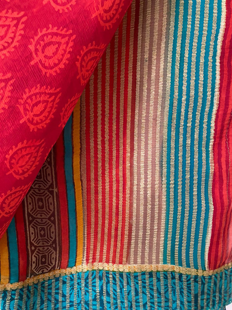 AALIA- A BEAUTIFUL PRINTED PURE CHIFFON IN RED WITH A GREEN BORDER