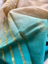 VIRNI- OMBRE OFFWHITE TO BLUE BANARASI GEORGETTE SAREE WITH WOVEN BOOTIS IN GOLD AND WHITE ALL OVER THE BODY AND A STRIPED ZARI AANCHAL