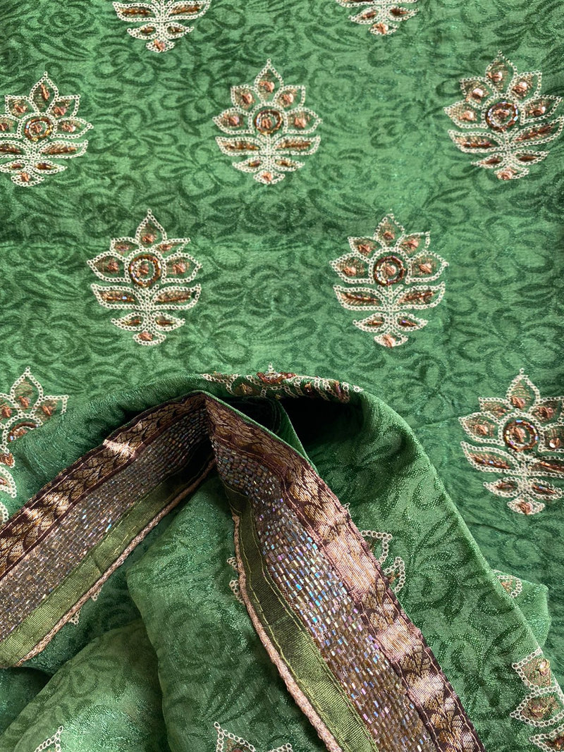 ARUSHI- A PRINTED PURE GEORGETTE IN GREEN WITH  EMBROIDERY AND SEQUIN WORK IN THE BODY, SEQUINED BORDER