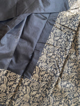 INDRANI- A BLACK COTTON BLEND SAREE WITH FULLY WOVEN BORDER AND AANCHAL AND UNSTITCHED BLOUSE PIECE