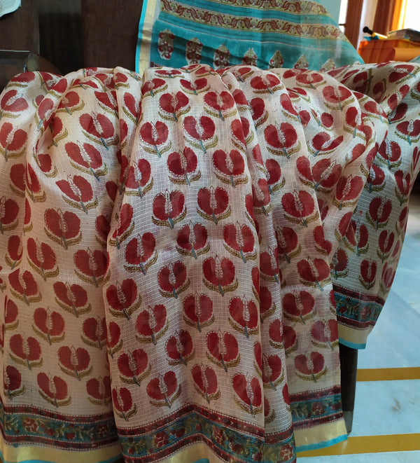 JASMINE A BEAUTIFUL PURE KOTA IN OFFWHITE WITH HAND BLOCK PRINTED FLORAL MOTIFS IN RED AND A CONTRAST AANCHAL