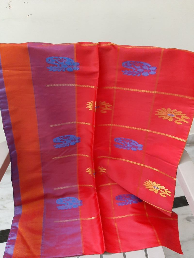 RUDHIRA- A SILK BLEND SAREE IN RED WITH GOLD SQAURES AND ALTERNATING BLUE AND GOLD MOTIFS WITHIN, ATTACHED BLOUSE PIECE IN CONTRAST COLOUR